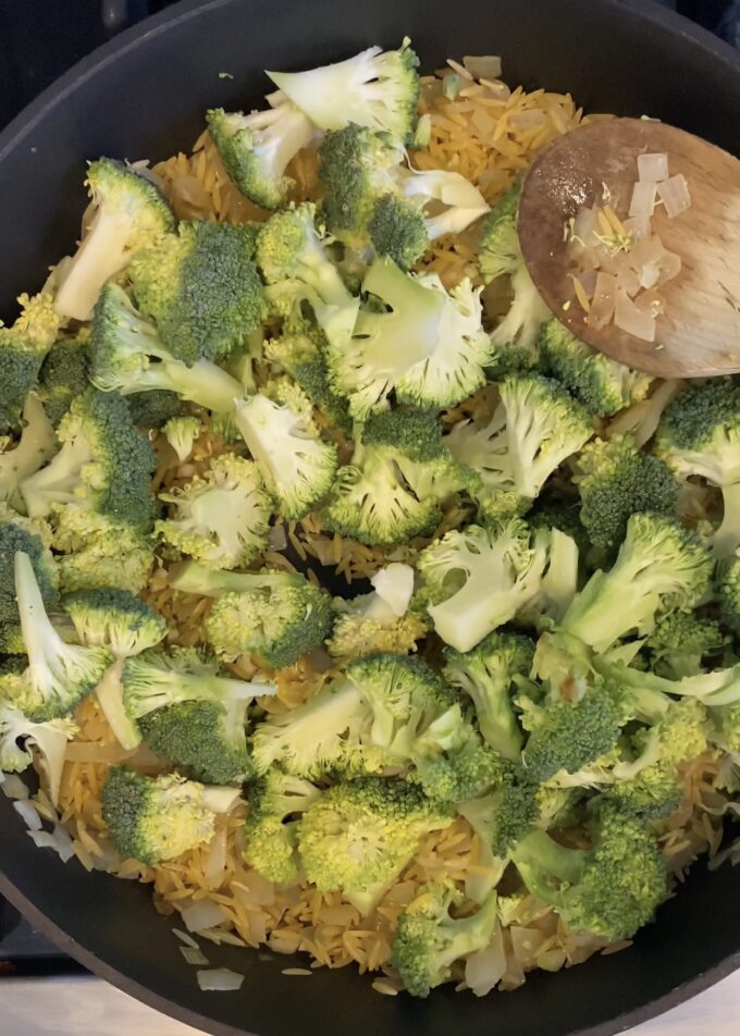 orzo and broccoli in a skillet