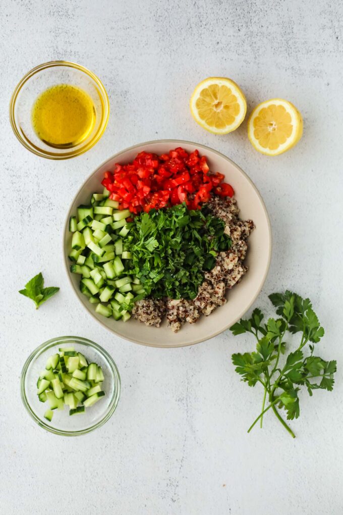 quinoa tabbouleh in a bowl before mixing