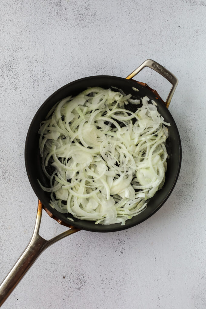 sliced onions in a skillet