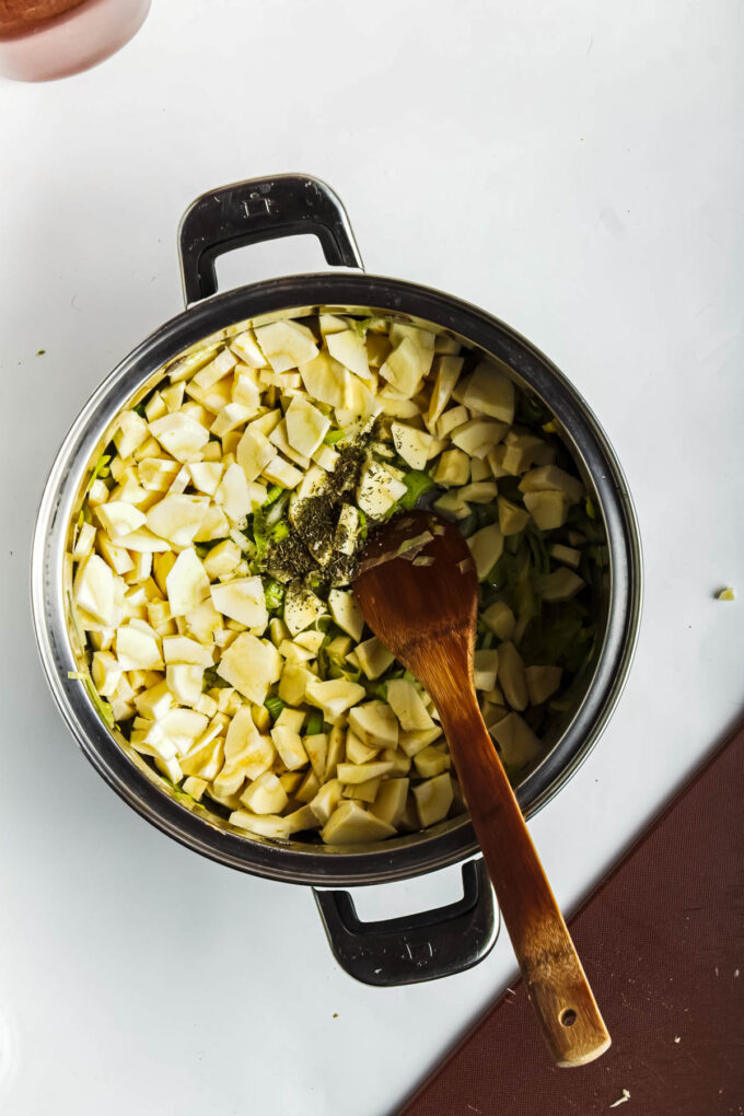 sauteed leeks and parsnips in a pot