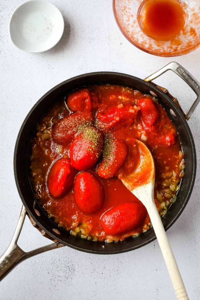 whole tomatoes in a pan