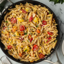 tomato and corn pasta in a skillet